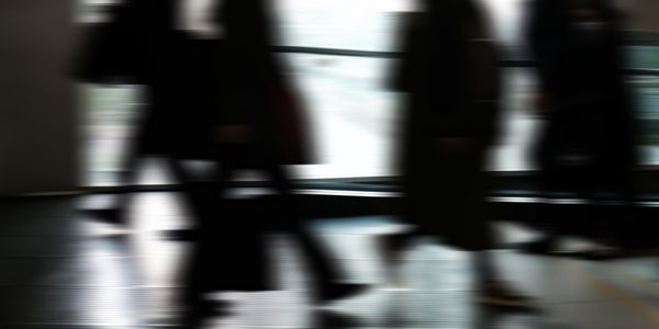 Abstract motion blur of a person exercising in dark room